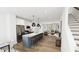 Open-concept kitchen featuring stainless steel appliances, and a large island at 1537 Piney Fls Dr, Wendell, NC 27591