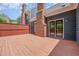 Large back deck with brick chimney, back door and space for outdoor living at 1547 Village Glenn Dr, Raleigh, NC 27612