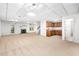 Finished basement with a fireplace, kitchenette, neutral carpet, and drop ceiling at 1547 Village Glenn Dr, Raleigh, NC 27612