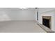Spacious finished basement with fireplace, neutral carpet and white paint at 1547 Village Glenn Dr, Raleigh, NC 27612