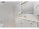 Bright bathroom featuring a single vanity and towel racks at 1547 Village Glenn Dr, Raleigh, NC 27612