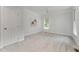 Bright bedroom featuring a neutral color scheme and carpeted floors at 1547 Village Glenn Dr, Raleigh, NC 27612
