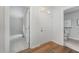 Inviting entryway features wood flooring, a white front door and leads to other rooms in the home at 1547 Village Glenn Dr, Raleigh, NC 27612