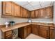 Basement kitchenette features wood cabinets, countertops, and a sink at 1547 Village Glenn Dr, Raleigh, NC 27612