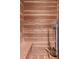 Wood sauna with bench seating and metal heater, perfect for relaxation and wellness at 1547 Village Glenn Dr, Raleigh, NC 27612