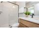 Modern bathroom featuring a glass-enclosed shower, wood vanity, and sleek fixtures at 1601 Merry Mdw Way, Wendell, NC 27591