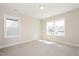 Bedroom featuring neutral carpet, recessed lights, and two large windows at 1601 Merry Mdw Way, Wendell, NC 27591