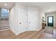 Inviting entryway with wood floors, neutral paint, and a green front door at 1601 Merry Mdw Way, Wendell, NC 27591