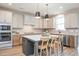 Spacious kitchen featuring white cabinets, a large island, and modern appliances at 1601 Merry Mdw Way, Wendell, NC 27591