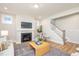 Cozy living room with a fireplace, comfortable seating, and a stylish rug at 1601 Merry Mdw Way, Wendell, NC 27591