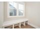 Mudroom with built in bench seating next to window at 1601 Merry Mdw Way, Wendell, NC 27591