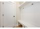 Functional mudroom with a built-in bench, storage hooks, and a neutral color scheme at 1601 Merry Mdw Way, Wendell, NC 27591