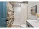 This bathroom features a tiled accent wall with a glass shower and new vanity at 1909 Ira Rd, Efland, NC 27243