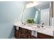 Well-lit bathroom with a double sink vanity, a large mirror, and stylish decor at 1909 Ira Rd, Efland, NC 27243