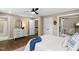 Bedroom featuring a dresser, a walk-in closet, and access to an ensuite bathroom and seating area at 1909 Ira Rd, Efland, NC 27243