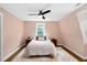 Cozy bedroom with hardwood floors, sloped ceilings, and a window offering natural light at 1909 Ira Rd, Efland, NC 27243