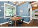 Cozy breakfast nook area featuring a round table, hardwood floors and charming trim at 1909 Ira Rd, Efland, NC 27243