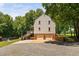 Rear view of the home with attached garage and a screened-in porch at 1909 Ira Rd, Efland, NC 27243