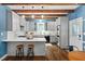 Modern kitchen with white cabinets, an island and stainless steel appliances, designed for cooking enthusiasts at 1909 Ira Rd, Efland, NC 27243