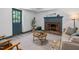 The living room features a brick fireplace, soft lighting and a cozy atmosphere at 1909 Ira Rd, Efland, NC 27243