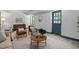 A comfy living room with two chairs, a couch, side table, and an outdoor view at 1909 Ira Rd, Efland, NC 27243