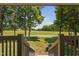 Scenic view from porch steps overlooking a lush green lawn and wooded area at 1909 Ira Rd, Efland, NC 27243