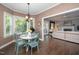 Bright breakfast nook with a bay window and casual dining set at 203 W Hill Dr, Cary, NC 27519