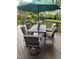 Outdoor deck with a dining table and umbrella providing ample space to relax at 203 W Hill Dr, Cary, NC 27519