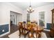Formal dining room with an elegant chandelier and wood flooring at 203 W Hill Dr, Cary, NC 27519