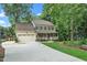 Inviting two-story home with a spacious driveway and attached two-car garage at 203 W Hill Dr, Cary, NC 27519
