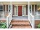 Welcoming front porch with brick steps and decorative details at 203 W Hill Dr, Cary, NC 27519