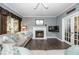 Inviting living room with a cozy fireplace and plush seating at 203 W Hill Dr, Cary, NC 27519