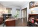 Home office with modern decor, wood floors, and ample natural light at 203 W Hill Dr, Cary, NC 27519