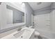 Well-lit bathroom featuring a vanity with a white countertop and shower-tub combo at 208 Maywood Ave, Raleigh, NC 27603