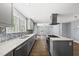 Modern kitchen featuring quartz countertops and stainless-steel appliances at 208 Maywood Ave, Raleigh, NC 27603