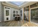 Back porch features a stainless steel grill and access to the home's interior and screened porch area for convenience at 21 Boots Dr, Angier, NC 27501
