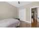 Bedroom featuring hardwood floors, neutral walls, and a double-door closet at 21 Boots Dr, Angier, NC 27501