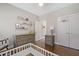 Cozy bedroom featuring two dressers, built-in shelves and a basketball hoop on closet door at 21 Boots Dr, Angier, NC 27501