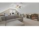 Versatile bonus room featuring plush carpet, comfortable couch, and two work stations at 21 Boots Dr, Angier, NC 27501