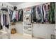 Walk-in closet with organized shelving, hanging rods, and ample storage space for clothes and accessories at 21 Boots Dr, Angier, NC 27501