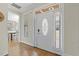 Bright entryway featuring hardwood floors and a decorative glass front door with sidelights at 21 Boots Dr, Angier, NC 27501