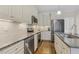 Kitchen with granite counters, stainless steel appliances, and white cabinets at 21 Boots Dr, Angier, NC 27501