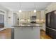 Kitchen with granite counters, a kitchen island, and stainless steel appliances at 21 Boots Dr, Angier, NC 27501