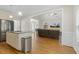Open concept kitchen view to the living room with a fireplace and hardwood floors at 21 Boots Dr, Angier, NC 27501