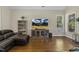 Warm living room with hardwood floors and a comfortable seating area at 21 Boots Dr, Angier, NC 27501
