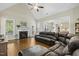 Bright living room with vaulted ceiling, fireplace, and large windows for natural light at 21 Boots Dr, Angier, NC 27501