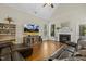 Cozy living room with fireplace and large windows, offering a relaxing atmosphere at 21 Boots Dr, Angier, NC 27501