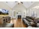 Spacious living room featuring vaulted ceilings, fireplace, and hardwood floors at 21 Boots Dr, Angier, NC 27501