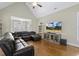 Open-concept living room with hardwood floors and comfortable seating at 21 Boots Dr, Angier, NC 27501