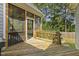 Lovely screened porch features wood floors and structure, along with peaceful views of the backyard and plenty of sunshine at 21 Boots Dr, Angier, NC 27501